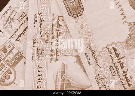 Monnaie Dirham background close up. Les tons de couleur marron Banque D'Images