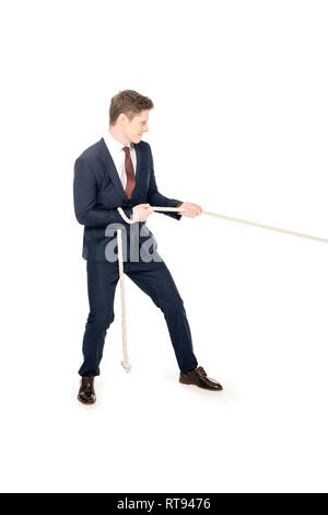 Élégant jeune businessman pulling rope isolated on white Banque D'Images