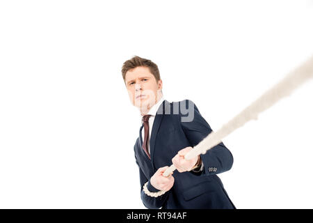 Beau jeune businessman pulling rope isolated on white Banque D'Images