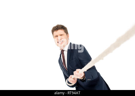 Young businessman pulling rope isolated on white Banque D'Images