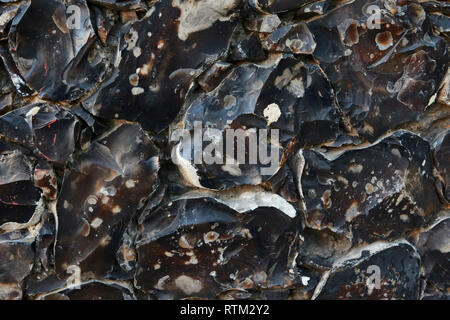 Flint rock abstract pattern intégré dans un mur dans le sud de l'Angleterre, Royaume-Uni, Europe Banque D'Images