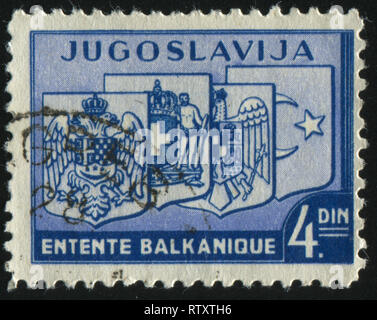 Russie KALININGRAD, 12 novembre 2016 : timbres en Yougoslavie, montre des armoiries de la Yougoslavie, la Grèce, la Roumanie et la Turquie, circa 1937 Banque D'Images