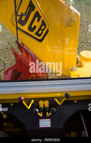 Le modèle qui fait grand JCB 3c - La position de conduite de chargeuse pelleteuse - UK Banque D'Images