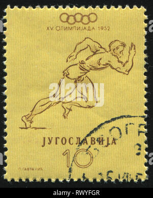 Russie KALININGRAD, 12 novembre 2016 : timbres en Yougoslavie, montre runner, vers 1952 Banque D'Images