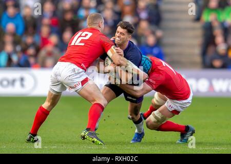 Edimbourg, Ecosse. . 09Th Mar, 2019. firo : 09.03.2019 Guinness, rugby 6 nations match entre l'Ecosse et au Pays de Galles au stade de Murrayfield, Edinburgh BT, Adam Hastings (#  22) de l'Ecosse est abordé par Hadleigh Parkes (#  12) et Justin Tipuric (#  7) du Pays de Galles | Conditions de crédit dans le monde entier : dpa/Alamy Live News Banque D'Images