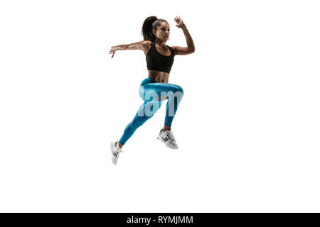 Young African woman isolated on white background studio. L'une coureuse ou du jogging. Silhouette d'athlète jogging Banque D'Images