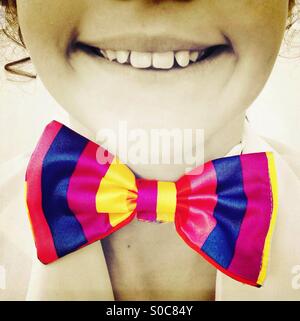 Smiling girl wearing colorful Bow Tie