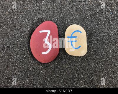 3 Euro avec plus de pierres de couleur sable volcanique noir Banque D'Images