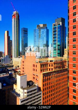 La copropriété dans le quartier branché de Manhattan quartier nomade comme vu à partir d'un appartement ou une location de toiture, NYC, USA Banque D'Images