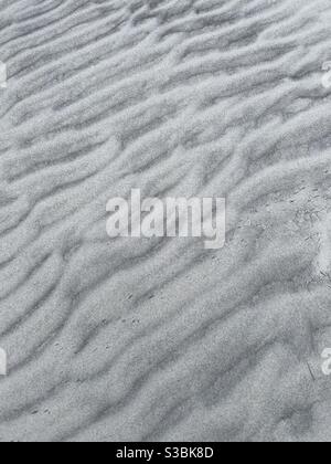 Arrière-plan abstrait de textures et de motifs sur sable blanc Banque D'Images
