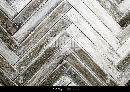 Des échantillons de sol de texture bois stratifié et sol pvc mosaïque sur fond de bois de chêne pour nouvelle construction ou rénovation de bâtiment ou rénover la maison Banque D'Images