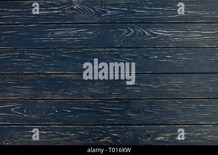 Dark Black wood texture background (vue de dessus). Les planches en bois sont empilées à l'horizontale et ont un look usé. Cette surface serait grand comme Banque D'Images