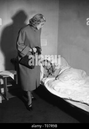 Les gens, la société, des règles de politesse, la visite d'une personne malade, scène, 1950 Additional-Rights Clearance-Info-Not-Available- Banque D'Images