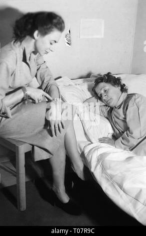 Les gens, la société, des règles de politesse, la visite d'une personne malade, scène, 1950 Additional-Rights Clearance-Info-Not-Available- Banque D'Images