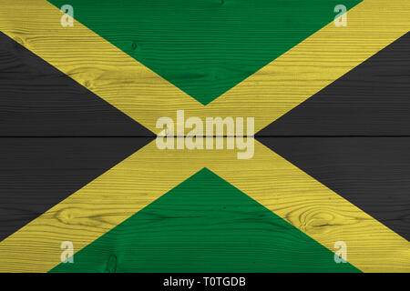 La Jamaïque drapeau peint sur la planche en bois ancien. Contexte patriotique. Drapeau national de la Jamaïque Banque D'Images