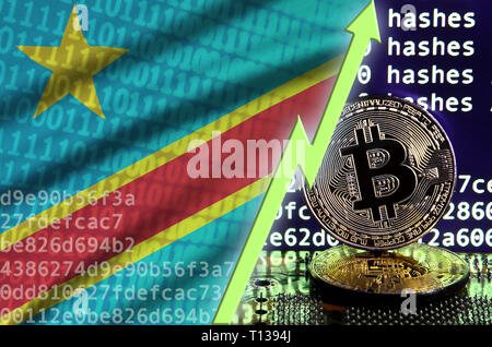 République démocratique du Congo d'un drapeau et l'augmentation de flèche verte sur l'écran d'exploitation minière bitcoin et deux d'or physique des bitcoins. Concept de conversion élevé dans Banque D'Images