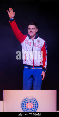 Resorts World Arena, Birmingham, UK. Mar 23, 2019. Coupe du monde de gymnastique ; Nikita le Nagorny-karabakh (RUS) vagues comme il vient pour le podium après avoir remporté la médaille d'Action Crédit : Plus Sport/Alamy Live News Banque D'Images