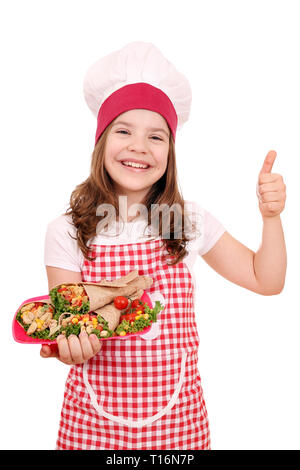 Happy little girl cook avec burritos mexican food et thumb up Banque D'Images