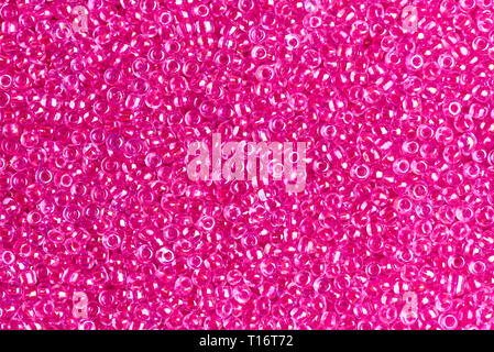 La texture de fond transparent perles rose close-up. Banque D'Images