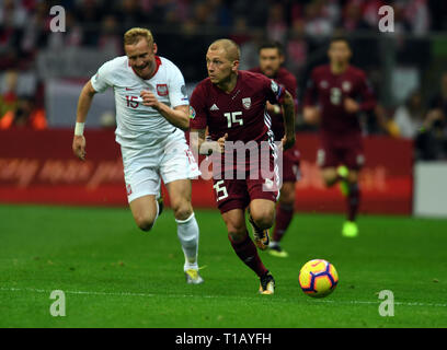 Varsovie, Pologne. 24 mars, 2019. Kamil Glik (Pologne) Deniss Rakels (Lettonie) en action pendant l'UEFA Euro 2020 - la Pologne attire la Lettonie en mars 24, 2019, Varsovie, le PGE le Stade National de Varsovie, la Pologne a gagné avec la Lettonie 2:0 Crédit : Maciej Gillert/Alamy Live News Banque D'Images