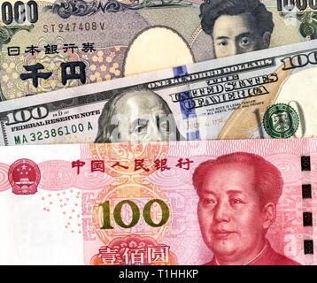 Yen japonais Dollar américain, billets et monnaie yuan chinois pour le commerce de la guerre et de l'impôt économique concept de barrière, la bourse d'Asie Banque D'Images