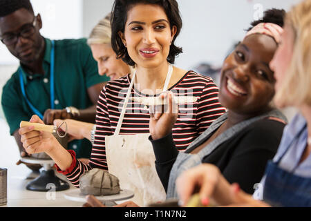 Happy friends enjoying art class Banque D'Images