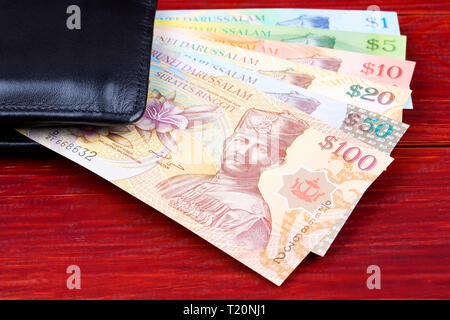 Le Brunei l'argent dans le porte-monnaie noir Banque D'Images