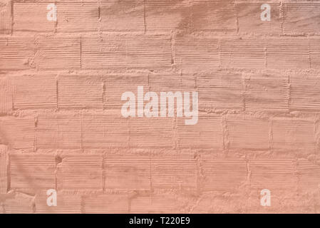 Crépi sur modèle mur de briques texture background tonique en couleur corail vivant Banque D'Images