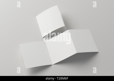 Brochure carrée à trois plis vierge sur fond blanc avec chemin de détourage autour de la brochure. Plié et déplié Banque D'Images