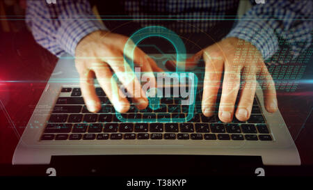 Man typing on laptop keyboard pour regarder sur l'écran holographique de cadenas. La cybersécurité, la sécurité sur internet et protection de l'ordinateur concept. Vue de face Banque D'Images