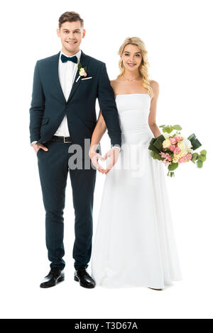 Belle mariée et le beau palefrenier montrant coeur signe avec mains isolated on white Banque D'Images