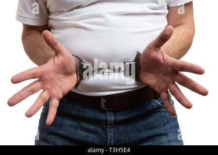 Libre de l'homme corrompu présentant mains menottées comme concept d'isolated on white background studio Banque D'Images