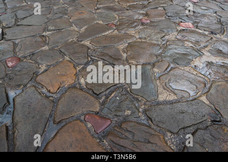 Arrière-plan de pierres naturelles. La route de la cobblestone. Banque D'Images