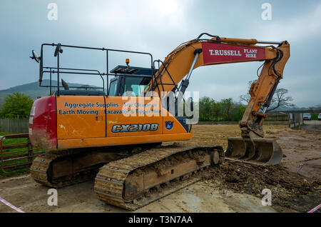 Une CASE CX210B excavatrice JCB à un emploi dans une ferme Banque D'Images