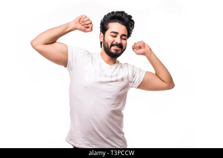 Beau jeune homme barbe heureux de sourire et de se sentir heureux sur fond blanc Banque D'Images