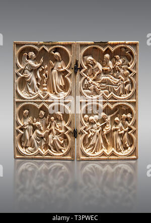 Diptyque d'ivoire gothique médiévale illustrant l'Annonciation, la Nativité, l'adoration des Mages et la crucifixion réalisé à Paris au cours du deuxième trimestre de Banque D'Images