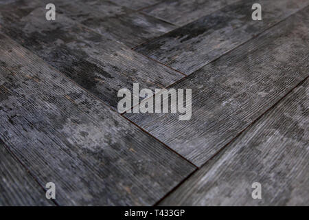 En vinyle, moderne avec du vieux bois imitation. Close-up de nouveau parquet gris avec texture de 600x600 avec grains brun et noeuds. Arrière-plan de décoration o Banque D'Images