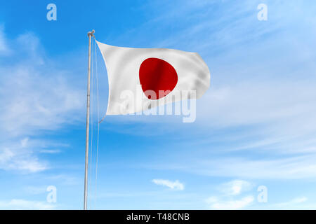 Le Japon d'un drapeau dans le vent sur fond de ciel bleu de nice Banque D'Images