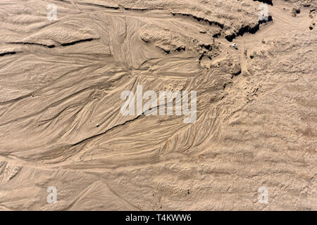 La texture du sable. Le sable brun. Arrière-plan de sable fin. Fond de sable Banque D'Images