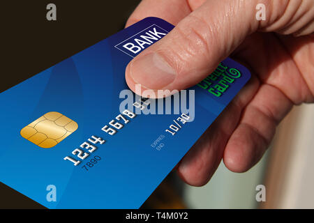 Close up of hand giving credit card Banque D'Images