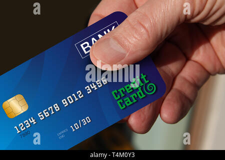 Close up of hand holding credit card Banque D'Images