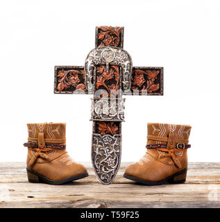 Prière de cowboy et mignon croix paire de bottes de cow-boy . Banque D'Images