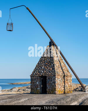 Le phare, faites par des pierres sur la "fin du monde" à la pointe sud de Tjøme, en Norvège, plus connu comme 'Phare à Balance Vippefyret'. C'est une réplique construite en Banque D'Images