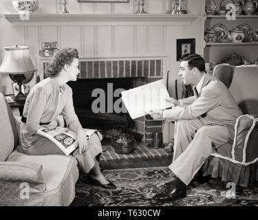 1950 COUPLE SITTING IN SUBURBAN CONFORTABLE SALON MARI SIGNALANT ARTICLE DE JOURNAL POUR LES FEMME - s1193 HAR001 HARS FEMELLES VIE conjoint marié MARI ACCUEIL COMMUNIQUER LA VIE DES FEMMES LES PERSONNES QUI S'OCCUPENT LES HOMMES B&W DISCUTER CONFORTABLE SALON DE LOISIRS DANS L'ENTHOUSIASME À PROPOS DES COMMENTAIRES ÉLÉGANT CURIEUX CONCEPTUEL ATTACHEMENT PERSONNEL INTÉRESSÉS COOPÉRATION AFFECTION ÉMOTION MID-ADULT MID-ADULT MAN MID-ADULT WOMAN DÉTENTE SOLIDARITÉ FEMMES NOIR ET BLANC DE L'ORIGINE ETHNIQUE CAUCASIENNE HAR001 old fashioned Banque D'Images