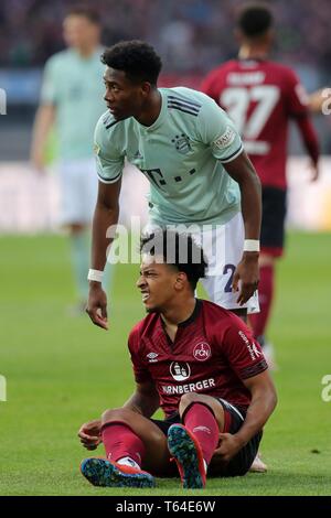 Nuremberg, Allemagne. Apr 28, 2019. 1. FC Nuremberg - FC Bayern Munich 1 : 1, David Alaba, Bayern Munich, FC Bayern, Munich, Munich, Matheus Pereira, 1. FC Nuremberg, Nurnberg, FCN, plein la figure, le geste, l'utilisation du crédit dans le monde entier | : dpa/Alamy Live News Banque D'Images