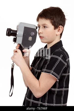 Jeune garçon avec de vieux analogique vintage camera 8mm Banque D'Images