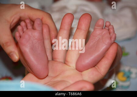 Un mois baby's feet Banque D'Images