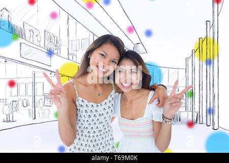 Image composite de deux jeunes femmes sourire faisant un geste de paix Banque D'Images