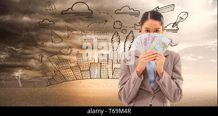 Composite image of businesswoman holding bank notes gourmand Banque D'Images