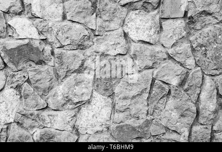 Plage mur gris. Mur de briques et pierres naturelles. Banque D'Images